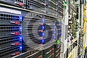 Racks with computer server devices. Hosted services are in the datacenter room. Cloud storage technologies.  Information center