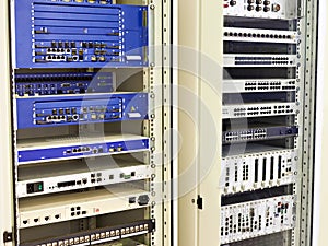 Racks with network switches and routers photo