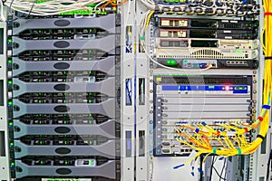 Racks with servers are located in the server room of the data center. Data processing center. A lot of internet equipment is photo