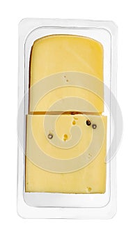 Raclette cheese slices in transparent plastic packaging, isolated on white background