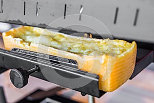 Raclette grilled melted cheese at a street food market