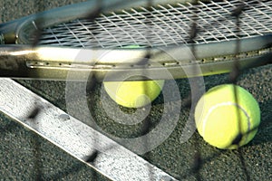 Racquet and balls through the net photo