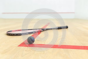 Racquetball equipment and wall with red lines