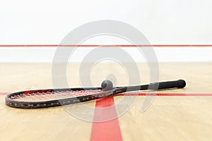 Racquetball equipment and wall with red lines