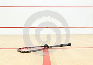 Racquetball equipment and wall with red lines
