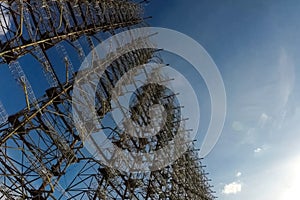 Radar arc in Chernobyl. Old collapsing radar antenna on sky background