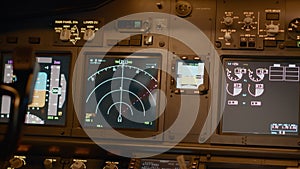 Radar compass and windscreen on dashboard in cockpit