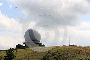 Radar dome on mountain Wasserkuppe with glider (sailplane) in Rhön Mountains, Germany