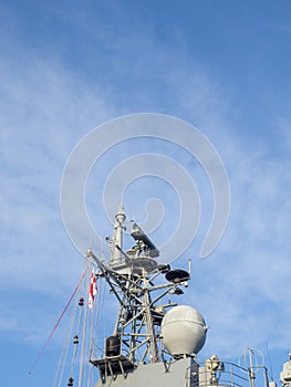 Radar system of a warship. Militarism. Ship electronics. tower against the sky