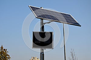 Radar to measure the speed of vehicles in the city. A reflective green sign on a pole with LED light numbers informs car drivers h