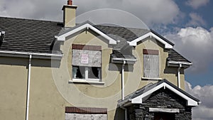 Radharc An Seascan, Meenmore, Dungloe, County Donegal, Ireland - May 30 2021 : The 2007 built houses sinking into the