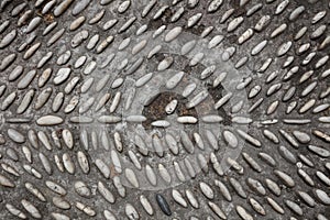 A radial surface of sand and pebbles