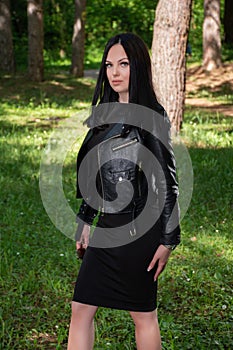 Radiant Beauty Amidst Nature: Captivating Woman in Black amidst the Forest