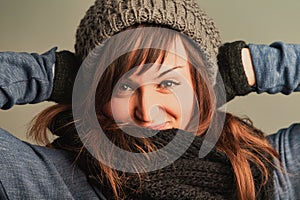 Radiant eyes, brunette defying winter's chilly embrace