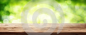 Radiant green spring background with wooden table photo