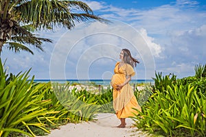 A radiant pregnant woman after 40 basking in the sun& x27;s warmth on a tropical beach, cherishing the serenity and bliss