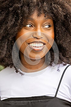 Radiant Smile of a Young Black Woman with Natural Hair