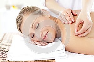 Radiant woman during an acupuncture treatment