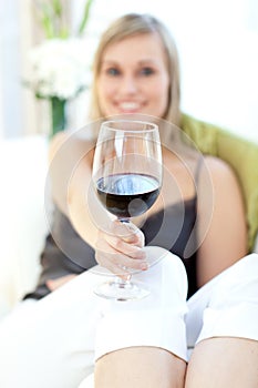 Radiant woman drinking red wine