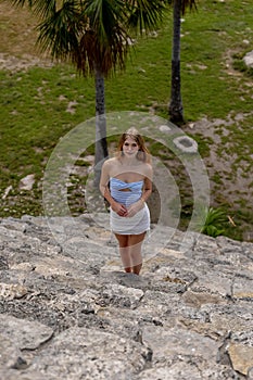 Ethereal Journey: A Young Beauty's Sojourn through Xcambo Mayan Ruins in Telchec, Yucatan, Amidst a Caribbean Oasis photo