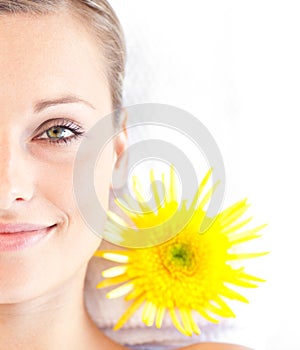 Radiant young woman lying on a massage table