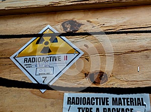 Radiation label beside the transport wooden box Type A package