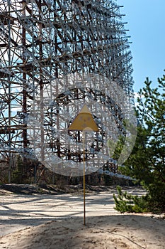 Radiation sign near telecommunication radio center Duga in Pripyat, Chernobyl