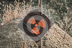 Radiation sign on a rusty metal plate. Hazard warning