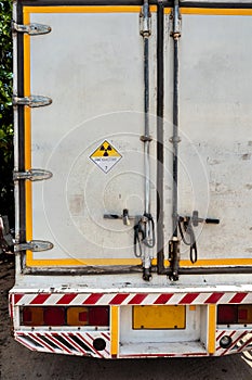 Radiation warning sign on the Dangerous goods transport label Class 7 at the container of transport truck