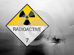 Radiation warning sign on the Dangerous goods transport label Class 7 at the container of transport truck