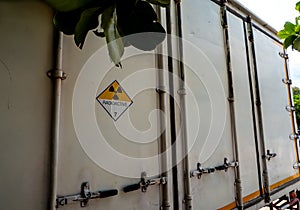 Radiation warning sign on the transport label Class 7 at the Door of the transport truck container
