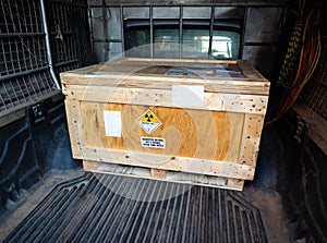 Radiation warning sign transport label Class 7 on the Dangerous goods package type A in the container of transport truck
