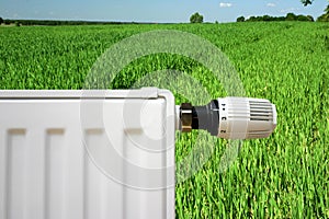 Radiator on a green field