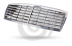 radiator grille on a white background made of shiny chromed metal is an element of the car body that protects and passes air to