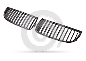 radiator grille on a white background made of shiny chromed metal is an element of the car body that protects and passes air to