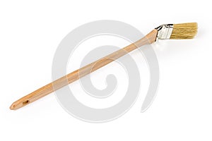 Radiator paintbrush with angled working part and long wooden handle photo