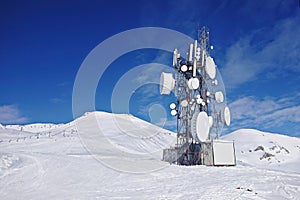 Radio aerial antenna mast with a lot of satellite dishes, parabolic reflector or dish antennas
