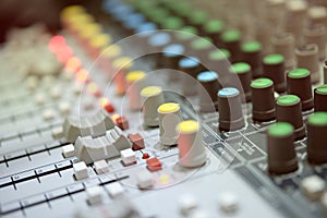 Radio analog mixer in broadcast room with blur backgound