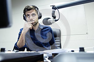 Radio anchorman hosts the serious evening show photo