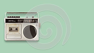 Radio cassette recorder and player on color background.