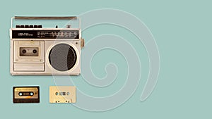 Radio cassette recorder and player with music tape cassette on color background