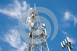 Radio, communication and cell towers on blue sky background