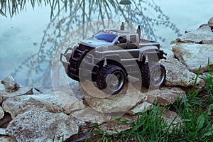 Radio-controlled children's car models. gray SUV truck, toys with remote control. Free