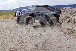 Radio controlled jeep overcomes the desert photo