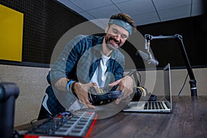 Radio dj with bandana on his head at the radio station