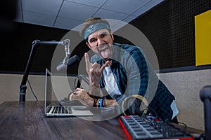 Radio dj with bandana on his head at the radio station