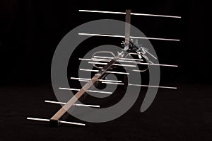 Yagi Uda antenna for UHF tv isolated on the black background