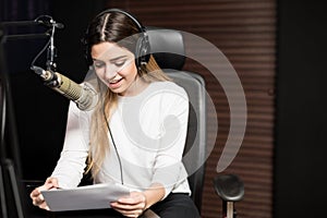 Radio host broadcasting a show in studio