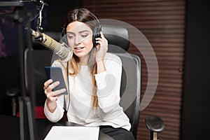 Radio host communicating on air in studio