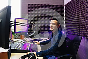 a radio host conducts a live broadcast in a professional radio studio.